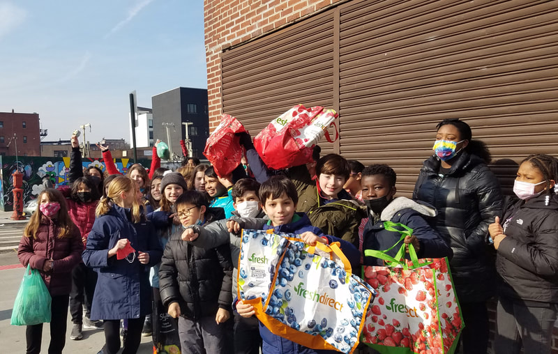 PS118 5th grade students donating the harvest to the soup kitchen.