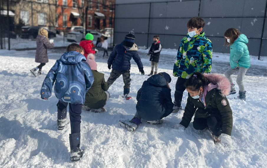 Students playing the snow at PS118.